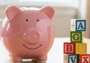 piggy bank next to blocks